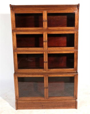 Lot 486 - An Early 20th Century Four Piece Sectional Bookcase, with six conforming glazed doors, the base...