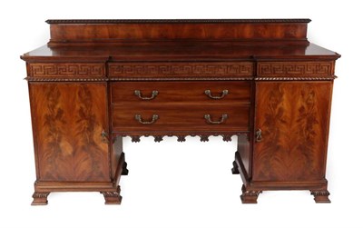 Lot 488 - ~ A Chippendale Revival Carved Mahogany Breakfront Sideboard, late 19th/early 20th century, the...