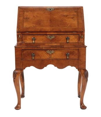 Lot 494 - A George I Style Walnut and Feather-Banded Bureau, the fall front enclosing an attractive...