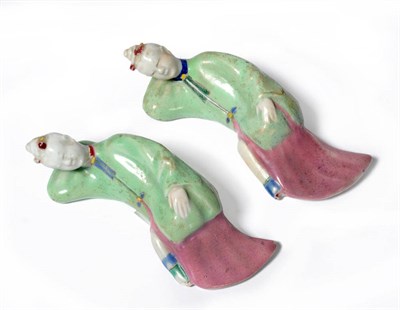 Lot 291 - A Pair of Chinese Porcelain Wall Appliqués, 18th century, as recumbent figures in green...