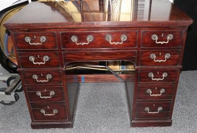 Lot 506 - A George III Mahogany Pedestal Writing/Architect's Table, after a model by Gillows, early 19th...