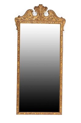 Lot 530 - ~ A George II Style Gilt Pier Glass, modern, the rectangular plate within a husk decorated...