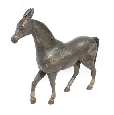 Lot 535 - ^ A Carved and Painted Primitive Model of a Dapple-Grey Horse, 20th century, 70cm by 72cm