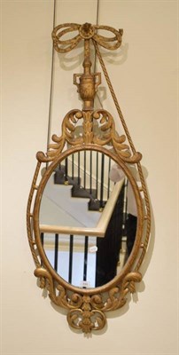 Lot 544 - A Carved Giltwood Mirror, the moulded frame with an acanthus carved apron and conforming plume...