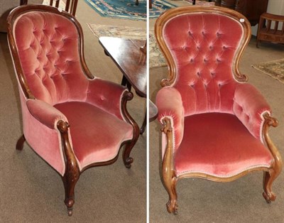 Lot 550 - Two Victorian Walnut Framed Armchairs, circa 1870, recovered in pink buttoned velvet,...