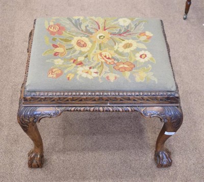 Lot 555 - A Chippendale Revival Carved Mahogany Dressing Stool, late 19th century, with floral needlework...