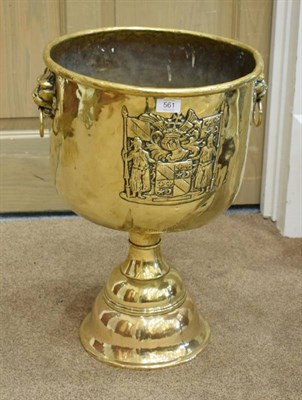 Lot 561 - A 19th Century Dutch Style Brass Pedestal Log Bin, with lion mask handles, decorated with a coat of