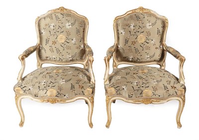 Lot 566 - A Pair of 19th Century Cream and Parcel Gilt Painted Armchairs, recovered in grey floral silk...