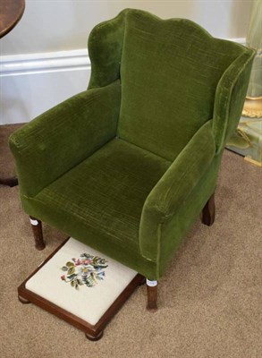 Lot 570 - ~ A 19th Century Child's Wing-Back Armchair, upholstered in green velvet with rounded arms above an