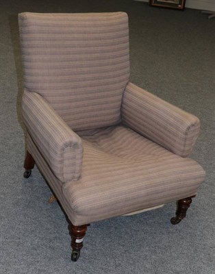 Lot 580 - A Victorian Armchair, late 19th century, covered in blue and cream striped fabric, with rounded...