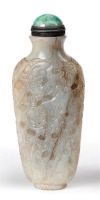 Lot 317 - A Chinese Jade Snuff Bottle, Qing Dynasty, circa 1750-1850, of flattened baluster shape, carved all