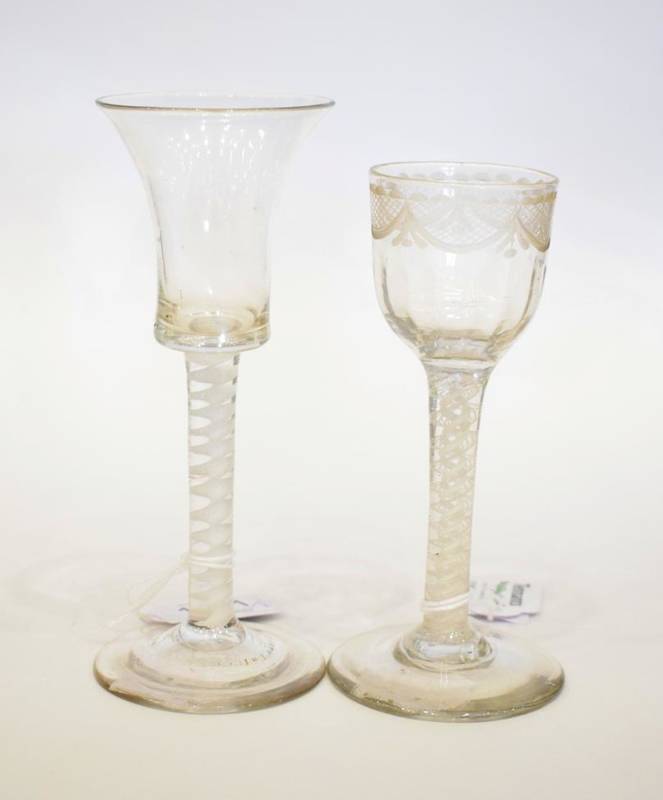 Lot 1181 - A Wine Glass, mid 18th century, the flared bucket bowl on an opaque twist stem, 15.5cm high;...