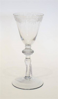 Lot 1187 - A Light Baluster Wine Glass, circa 1740, the rounded funnel bowl engraved with a border of...