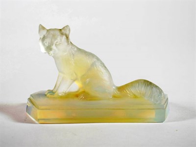 Lot 1191 - A Jobling Iridescent Glass Model of a Fox, 1930's, on a shaped rectangular plinth, 14cm long