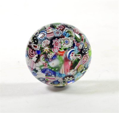 Lot 1195 - A Clichy Scrambled Millefiori Paperweight, circa 1850, set with a profusion of coloured canes,...