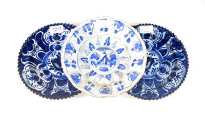 Lot 1217 - A Pair of Delft Plates, early 18th century, painted in blue with panels of stylised foliage,...