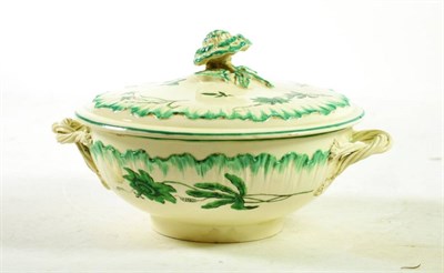 Lot 1219 - A Wedgwood Creamware Ecuelle and Cover, circa 1790, with entwined handles and rose knob, painted in