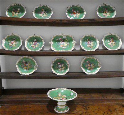 Lot 1229 - An English Porcelain Dessert Service, circa 1840, decorated with shells and foliage on a green...