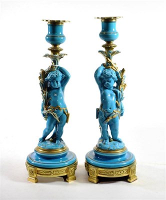 Lot 1232 - {} A Pair of Gilt Metal Mounted Minton Turquoise Glazed Candlesticks, circa 1870, modelled as...