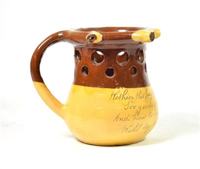 Lot 1236A - An Isaac Button Soil Hill Pottery Slipware Puzzle Jug, 20th century, inscribed WITHIN THIS JUG...