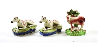 Lot 1238 - A Pair of Pearlware Hounds, probably Yorkshire, circa 1820, naturalistically modelled with...