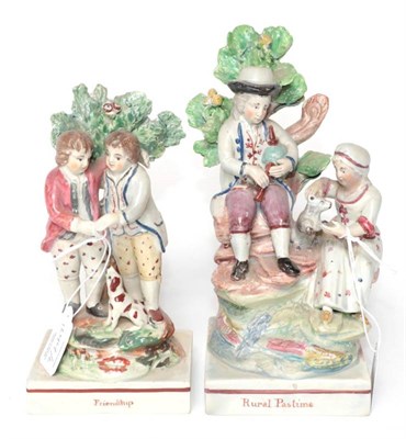 Lot 1244 - A Ralph Wood Type Pearlware Figure Group of Rural Pastime, circa 1820, modelled as a couple sitting