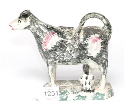 Lot 1251 - A Pearlware Cow Creamer, circa 1820, with black and manganese markings, a milkmaid to one side,...