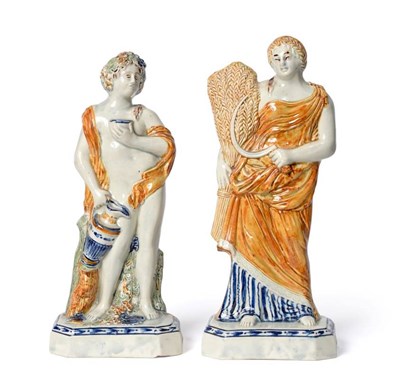 Lot 1256 - A Pair of Pratt Type Figures of Classical Seasons, circa 1800, Summer as a maiden with a sheaf...