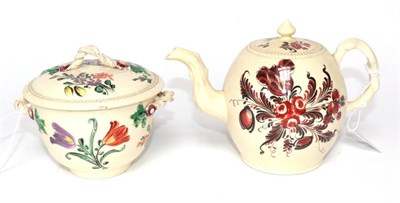 Lot 1306 - A Creamware Teapot and Cover, circa 1770, painted in the manner of Robinson & Rhodes with red...