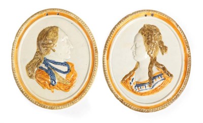 Lot 1325 - A Pair of Pratt Type Pottery Oval Plaques, circa 1800, moulded and painted with bust portraits...