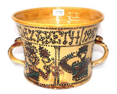 Lot 1332 - ~ A Slipware Loving Cup, commemorating the Silver Jubilee of Queen Elizabeth II, 19cm high