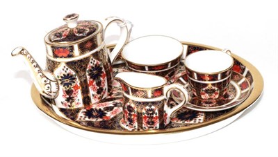 Lot 1333 - ~ A Royal Crown Derby Imari Pattern Miniature Tea Service, comprising a teapot and cover, milk jug