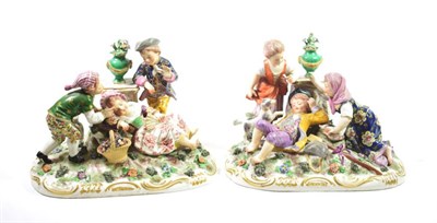 Lot 1337 - A Pair of Derby Style Porcelain Figure Groups, late 19th/early 20th century, as children...