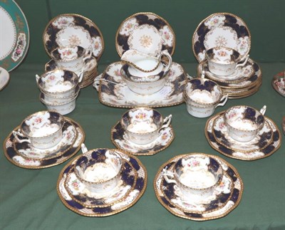 Lot 1337A - ~ A Coalport Porcelain Blue Batwing Service, for twelve settings (39)