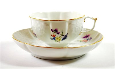 Lot 1349 - A Meissen Porcelain Tea Cup and Saucer, circa 1750, painted with flowersprigs on a foliate...