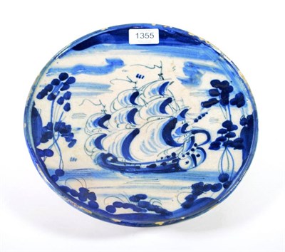 Lot 1355 - An Italian Maiolica Tazza, probably Ligurian, 18th century, painted with a galleon in blue,...