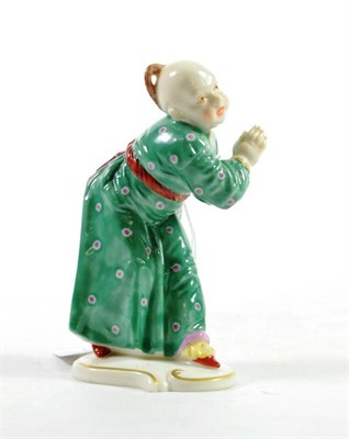 Lot 1358 - A Nymphenburg Porcelain Figure, 20th century, after Franz Anton Bustelli, as a Chinese boy in a...