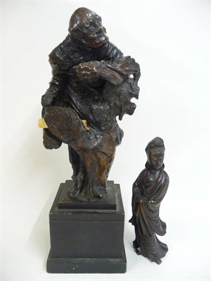 Lot 335 - A Japanese Rootwood Carving of an Old Man, Meiji Period (1868-1912), his head turned to...