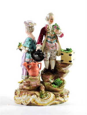 Lot 1363 - A Meissen Figural Group, 19th century, modelled as a gallant and his beau, on rocky...