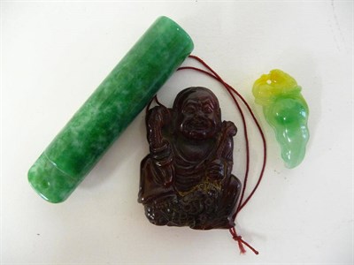 Lot 336 - A Chinese Carved Amber Figure of Buddha, late 19th century, sitting holding to sceptres, 5cm...