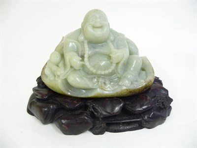 Lot 338 - A Chinese Jade Figure of a Pu-tai, the seated corpulent figure with his bag over his shoulder,...