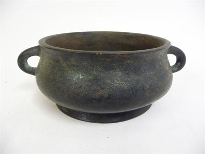 Lot 339 - A Chinese Bronze Censor, Qing Dynasty, of archaic form, cushion moulded circular with two loop...