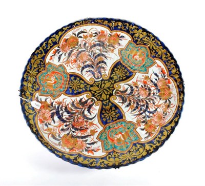 Lot 1403 - An Imari Porcelain Large Dish, Meiji period, of fluted circular form, typically painted with...