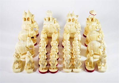 Lot 1414 - An Indian Maharajah Camels' Tooth Chess Set, modern, carved as figures on elephants, camels and...