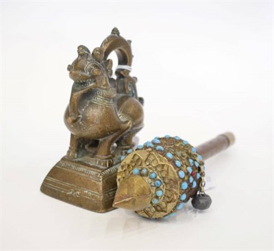 Lot 1417 - A Nepalese Brass Prayer Wheel, with turquoise decoration, 21cm; and A Large Opium Weight, in...