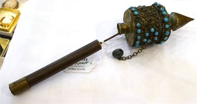 Lot 1417 - A Nepalese Brass Prayer Wheel, with turquoise decoration, 21cm; and A Large Opium Weight, in...