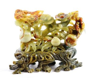 Lot 1419 - A Chinese Jade Type Floral Carving, of rectangular form decorated with flowering branches, 24cm...