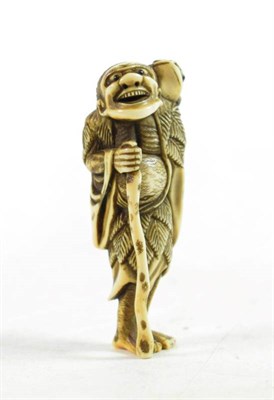 Lot 1450 - A Japanese Ivory Netsuke, Meiji period, in the form of a Gama Senin, with horn eyes, 6.5cm high