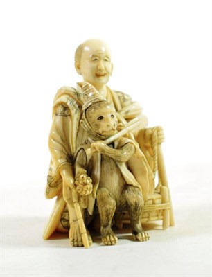 Lot 1457 - A Japanese Ivory Okimono, Meiji period, as a showman with a performing monkey and a drum, signed to