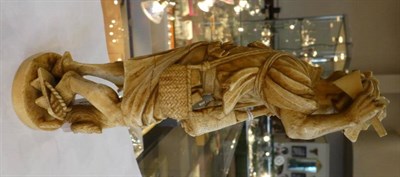 Lot 1458 - A Japanese Ivory Okimono, Meiji period, as an old a man holding a Biwa and plectrum, a dog at...